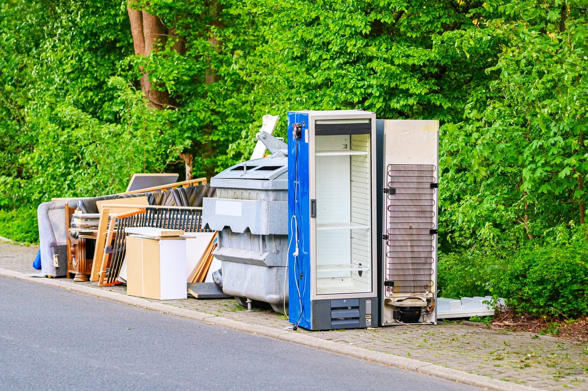 Discarded household appliances and furniture piled up for collection